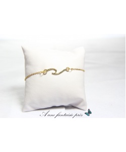 1206_-_bracelet_acier_inoxydable_dor_pendentif_vague__15_euros